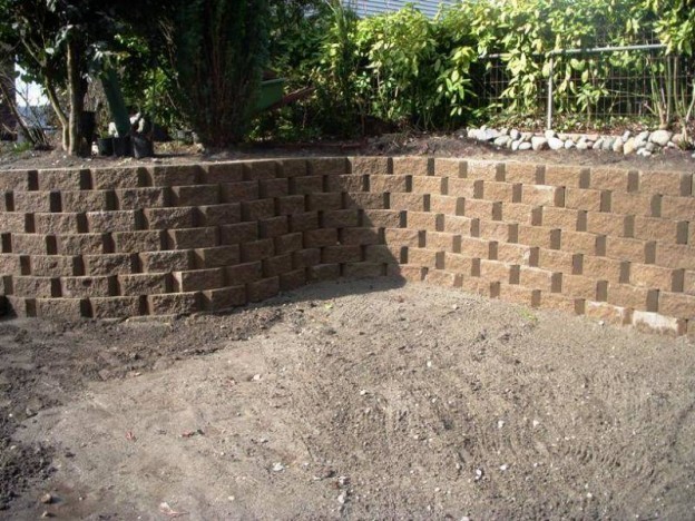 New brick-colored concrete retaining wall