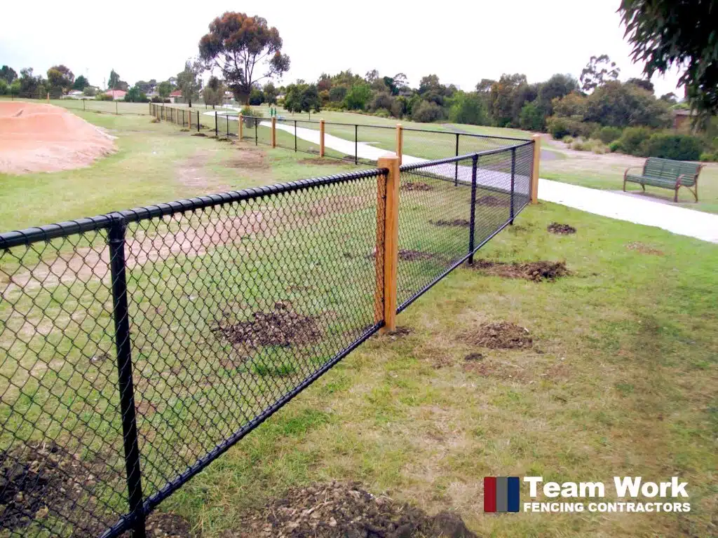 Custom black chainlink fence installation in Perth Western Australia
