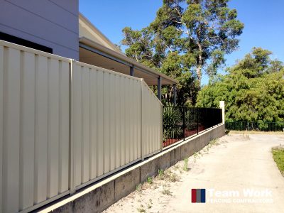 Feature Fence combinining Colorbond steel fence with decorative steel fencing.