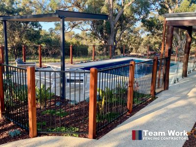 Flat top pool fencing with merbau posts notched at the top build in Baldivis
