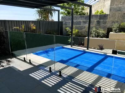 Frameless-Glass-Pool-Fencing-With-Black-Fittings