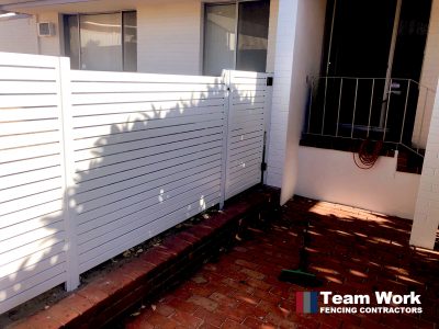 White horizontal aluminium slat fencing installation in Perth, Western Australia.